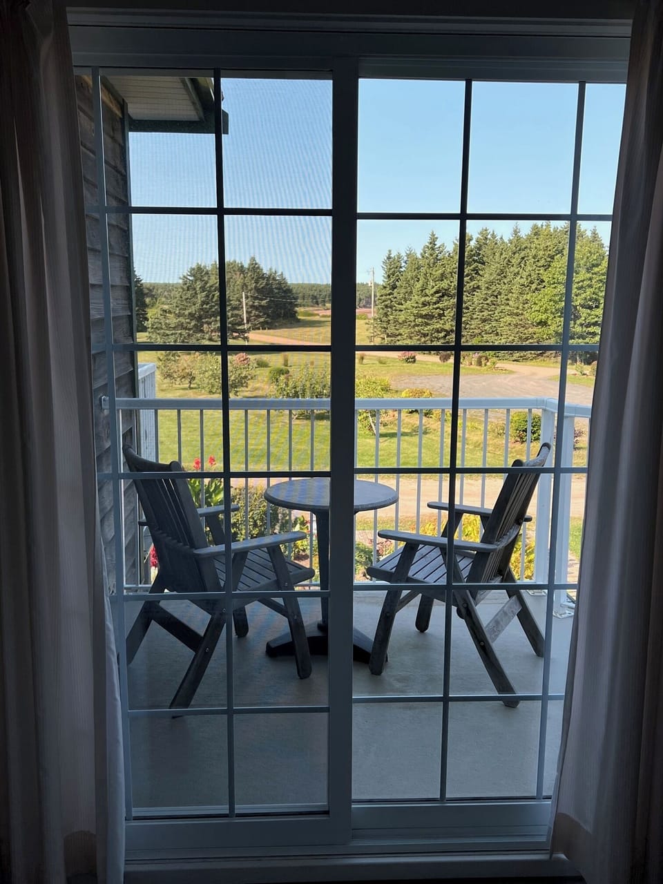 Guest room balcony looking up the peninsula towards Sally's Beach Provincial Park