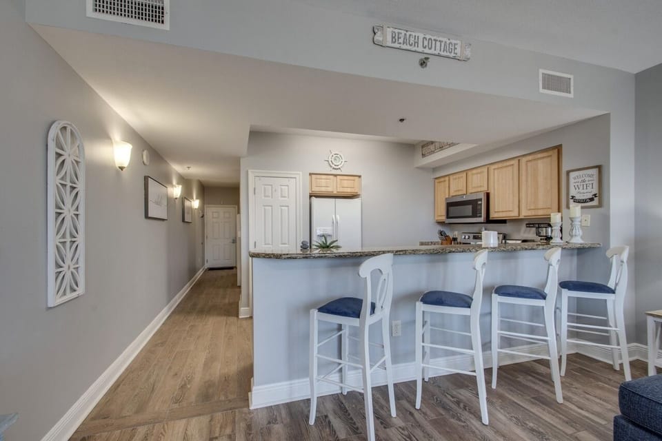 Enjoy your meals on the hightop counter with four comfortable stools included
