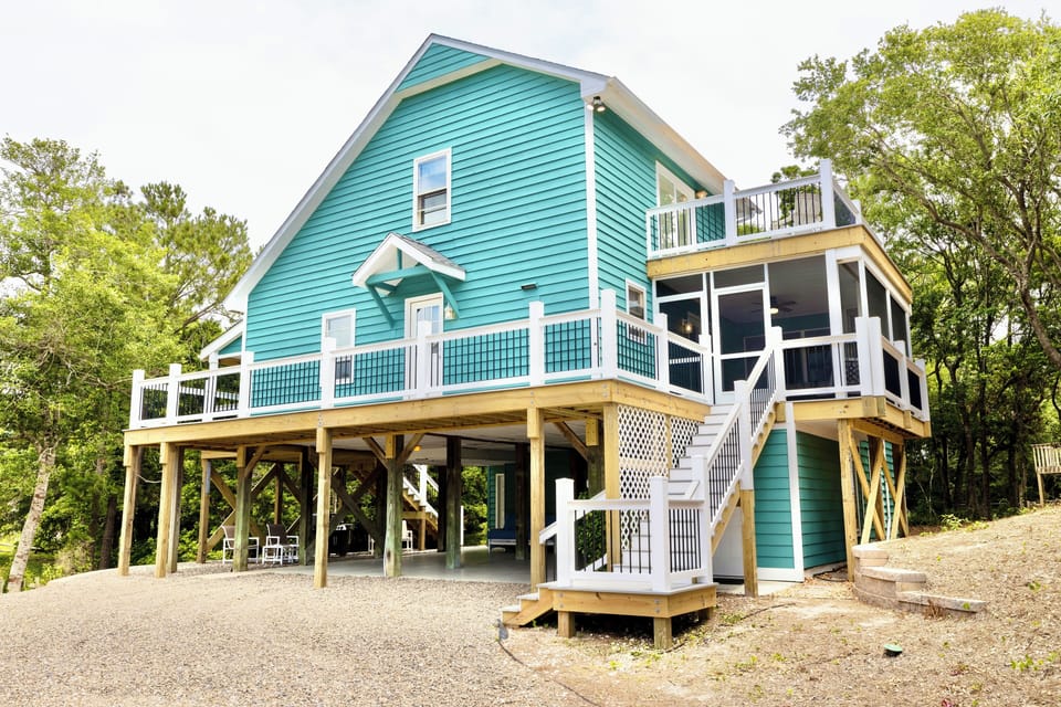 Beach Please is a 3bed/2bath oceanside home, wrapped in decks and screened porch