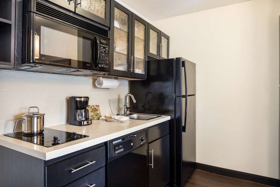 Prepare quick breakfasts with a full fridge and cooktop.