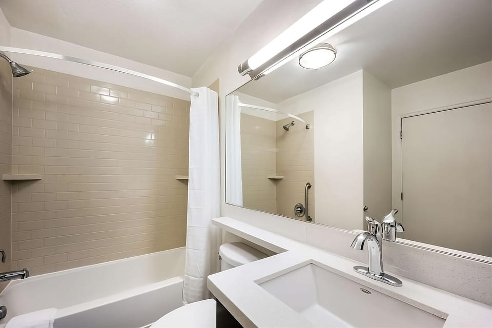 Get ready faster with a wide vanity and large mirror.