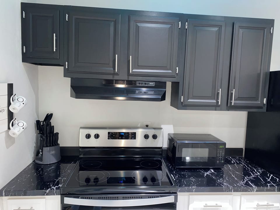 Full kitchen with stove, oven, miocrowave and refrigerator
