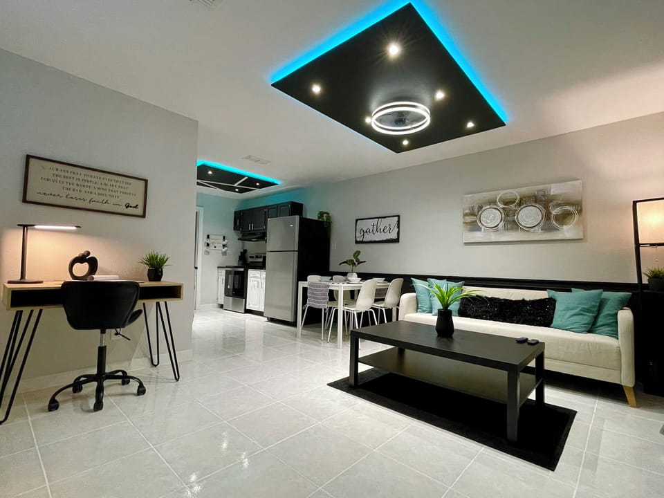 Living room with led lights that can change color to set the mood.
