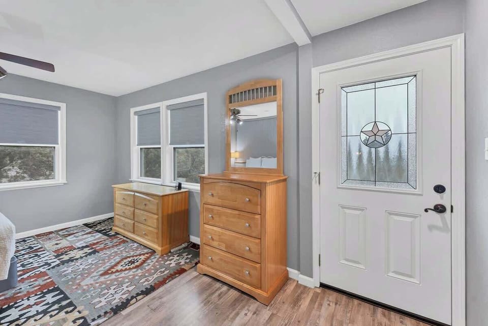 The downstairs bedroom is equipped with two dressers for extra storage.