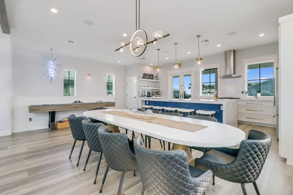 Gather around this stunning open-concept space where your gourmet kitchen flows into elegant dining, perfect for memorable meals together.