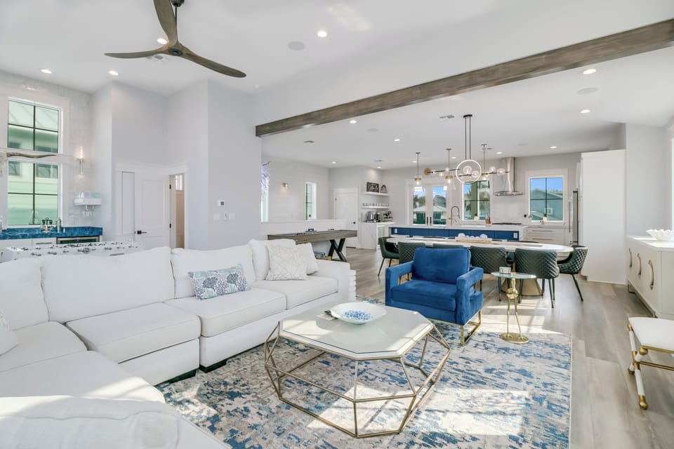 Relax in your beautifully designed open-concept living space, where coastal blues and whites create a serene atmosphere for unwinding after your adventures.