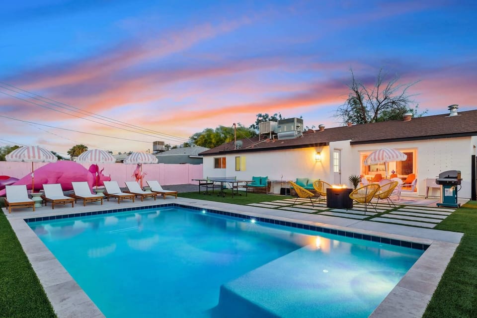 Colorful poolside retreat w/ vibrant design details & a sleek pool for relaxing afternoons.