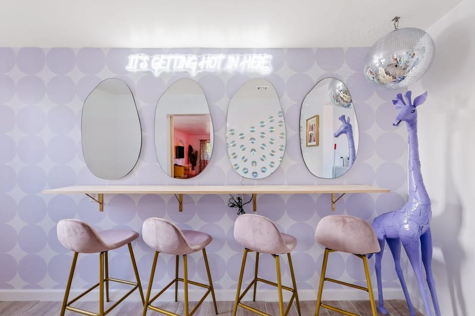 Bar-style counter w/ sculptural stools & a clean, modern look.