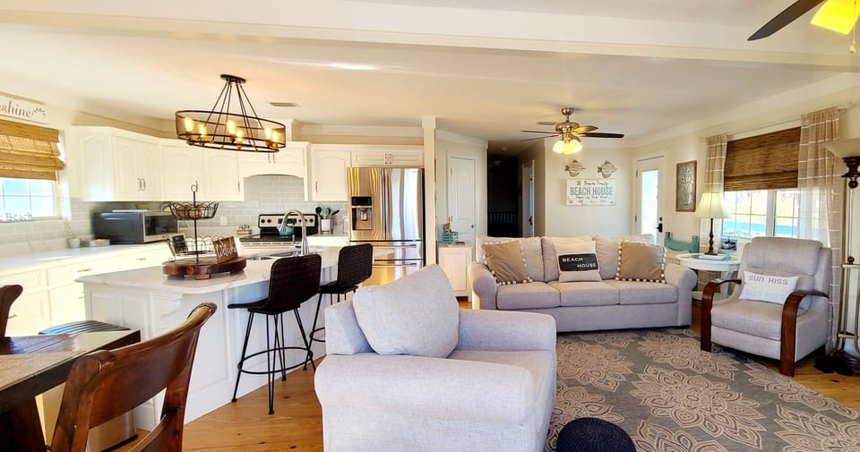 Open floor plan. Pine Wood floors. New furniture with plenty of setting area.