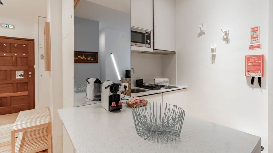 Our kitchenette counts with modern appliances and ample counter space for easy meal preparation #practical #simple