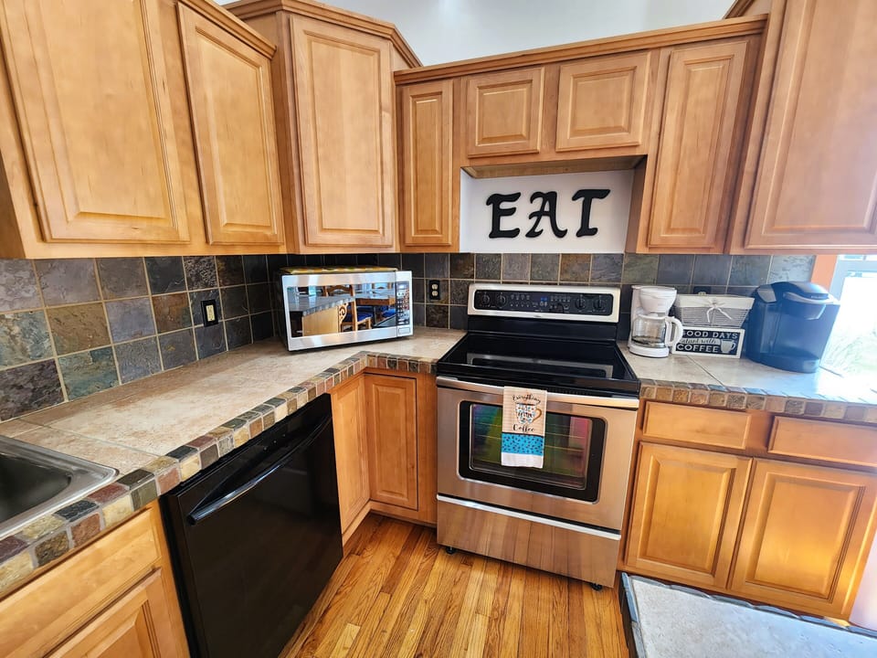 Open, fully equipped kitchen w/ full-sized appliances and Keurig/coffee maker