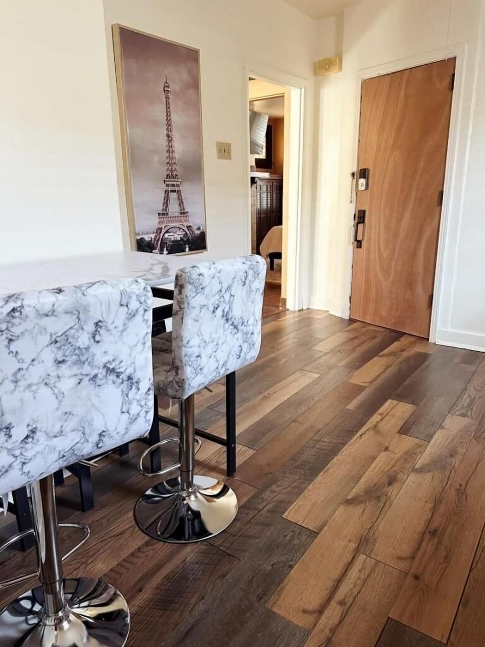 Dining table seats 4. There are 2 high back chairs and2 stools.