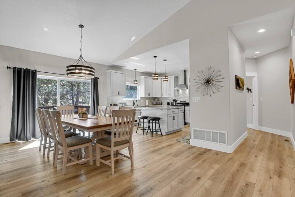 Another view of the dining area and kitchen