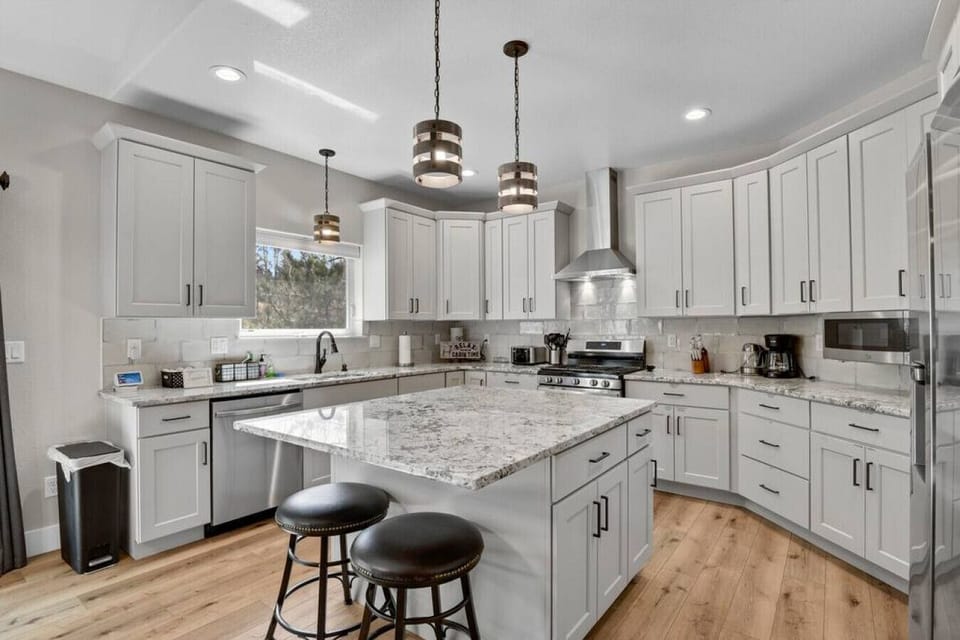 Stocked Kitchen with Drip Coffee Maker, Coffee, Creamer, Sugar, Tea, Tin Foil, and More.