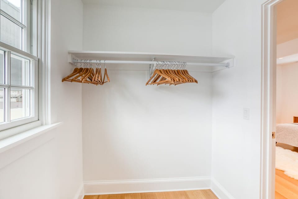 Ample closet space with hangers in the primary bedroom