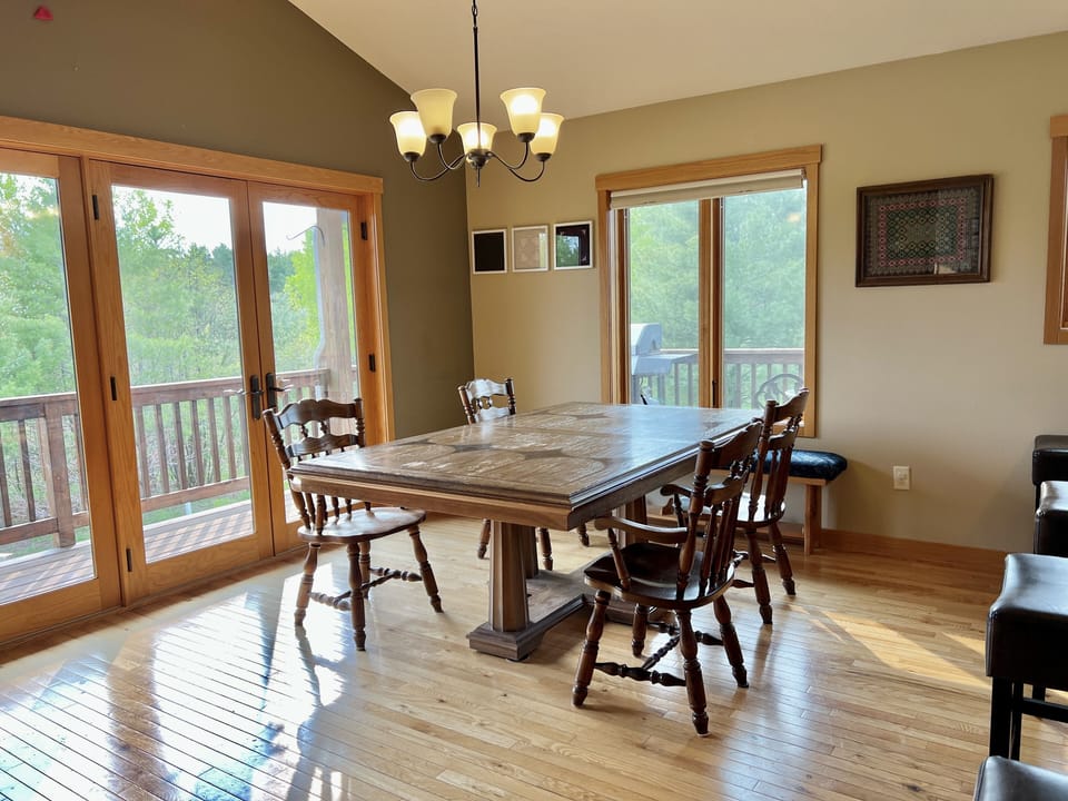 Dining table. Outside is the deck. 