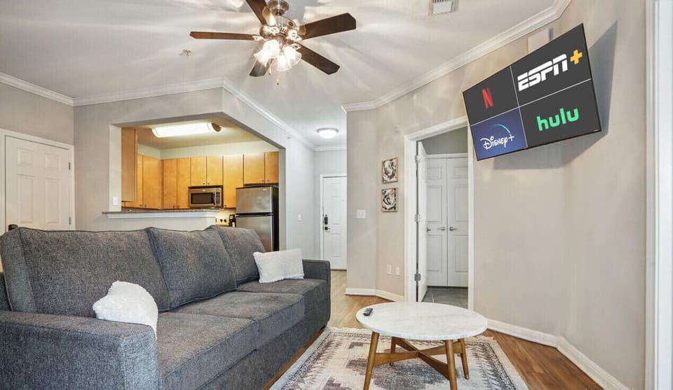 Open living room with sleeper sofa and smart tv