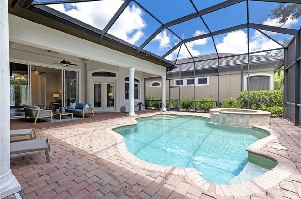 Oversized lanai with oversized pool and spa.