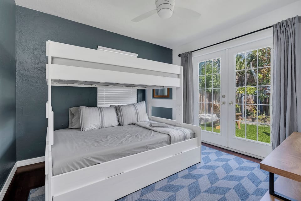 Twin beds on top and trundle underneath. Main bed is full size bed