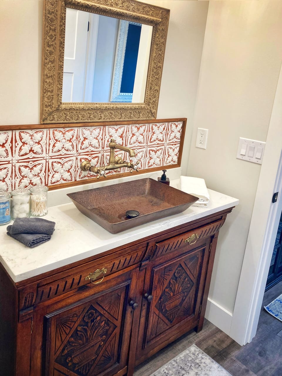 Custom vanity with tin tile backsplash from one of Yakima’s original buildings.