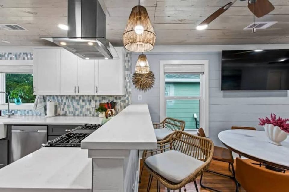 The kitchen connects to the living room for easy entertainment.