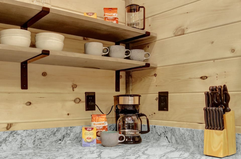 Coffee and tea are providers. There is a drip coffee pot and a French press.