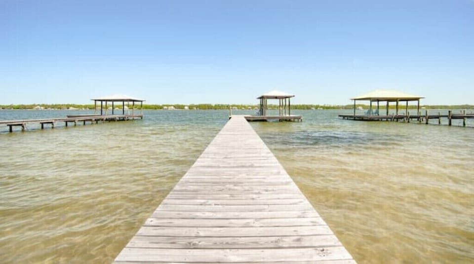 Private pier.  Shallow, sandy beach area.  Great for swimming & launching kayaks