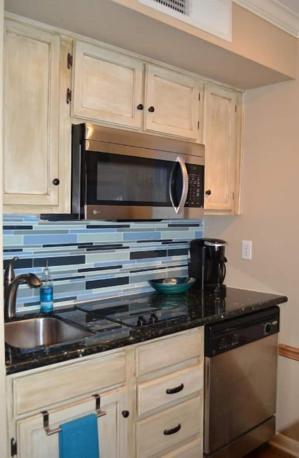 Dishwasher inside the condo for your convenience. Includes cookware and utensils