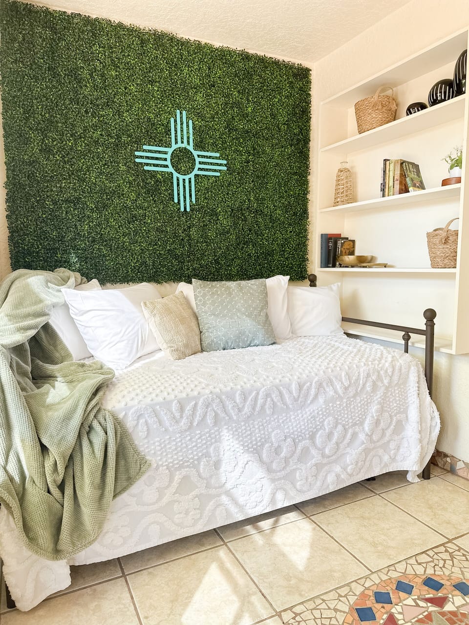 Curl up in this one of a kind sunroom- with our NM zia artwork and read a book!