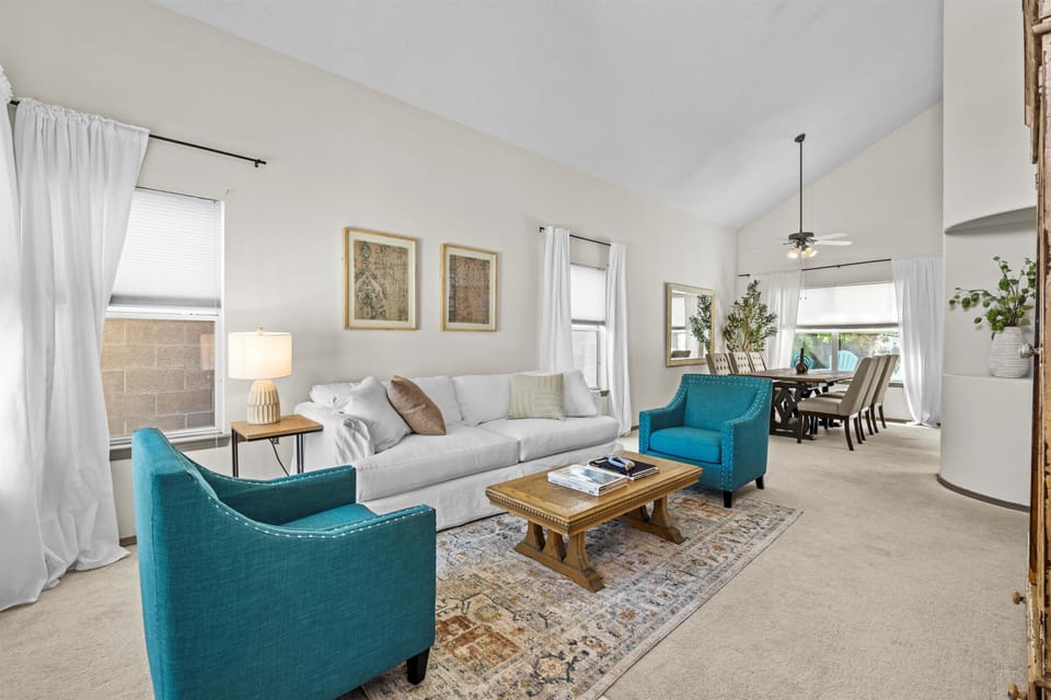 French country seating area with queen sleeper sofa- and gorgeous dining room!