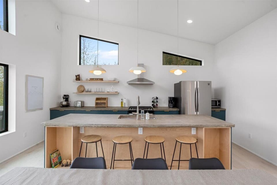 Upstairs: Modern clean lines and cement countertops.