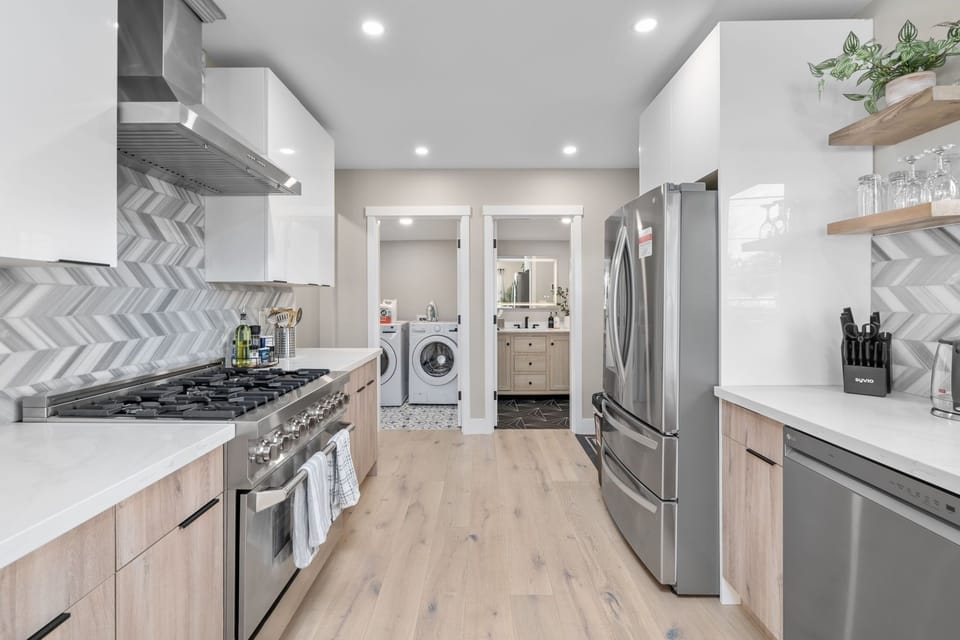 The fully equipped gourmet kitchen awaits you to fulfill your culinary desires. 
