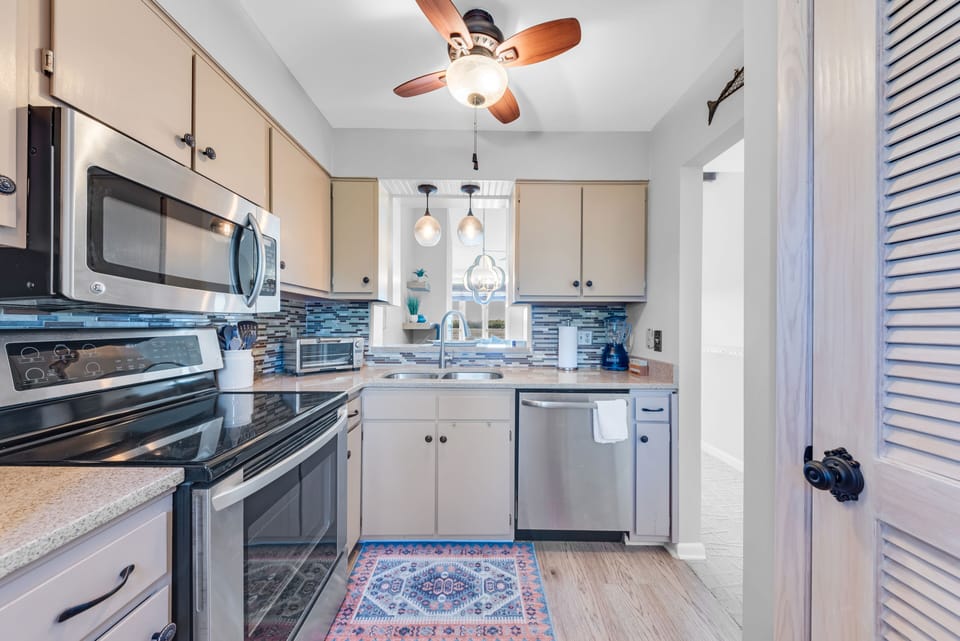 The kitchen has stainless steel appliances