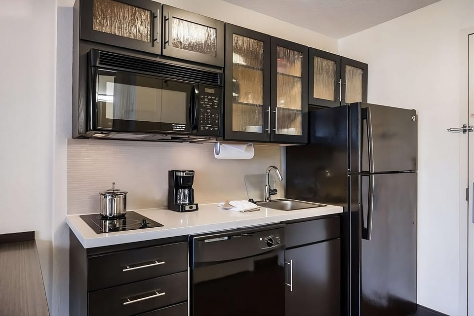 Whip up easy meals with a sleek, compact kitchenette.