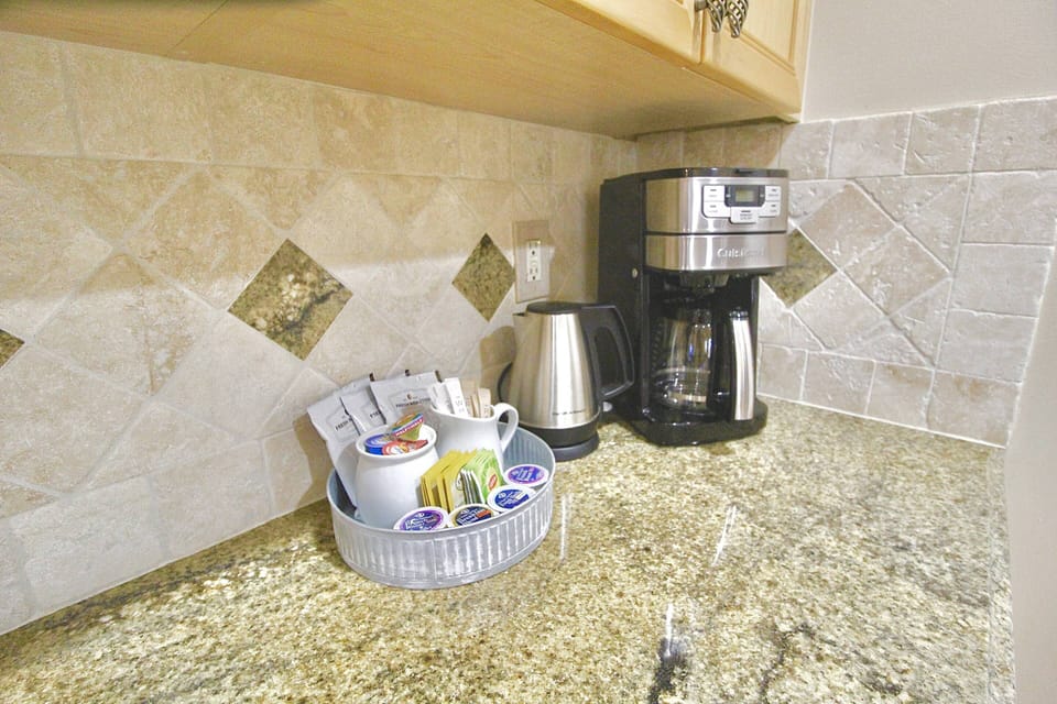 Enjoy the fully stocked coffee bar area, with coffee pot brewer and electric tea kettle.