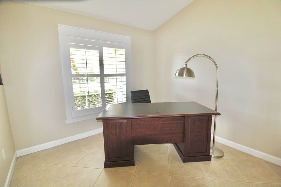 The corner desk area offers a great workspace for students or business travelers to set up.