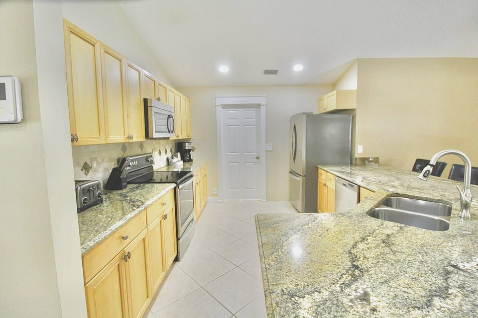 The fully equipped kitchen has stainless Steele appliances and plenty of counter space to prep, cook and dine…