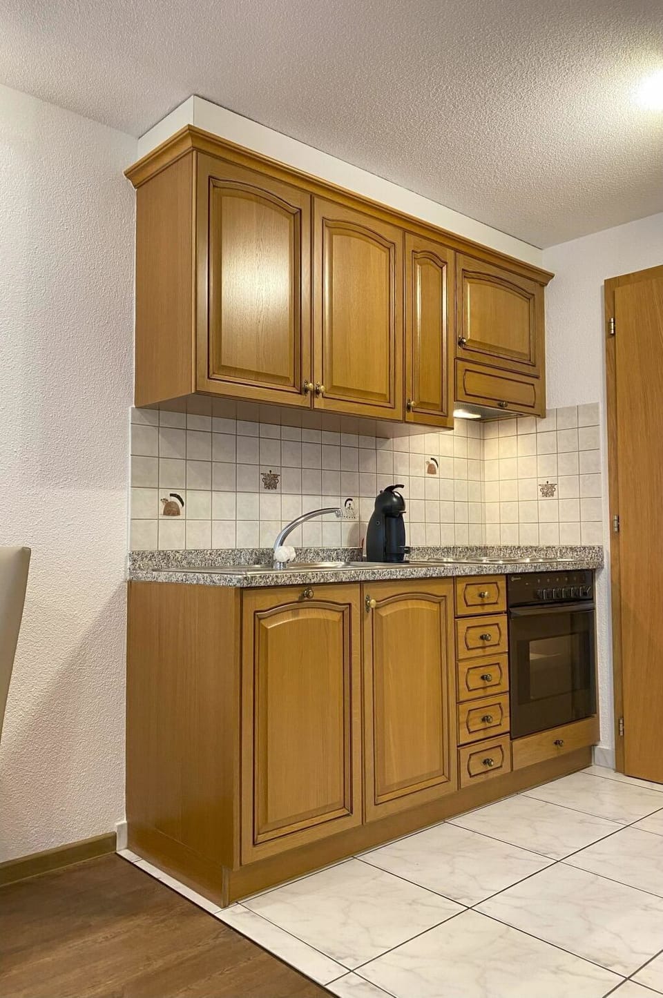 Countertop, Cabinetry, Property, Sink, Kitchen, Wood, Tap, Flooring, Interior Design, Building