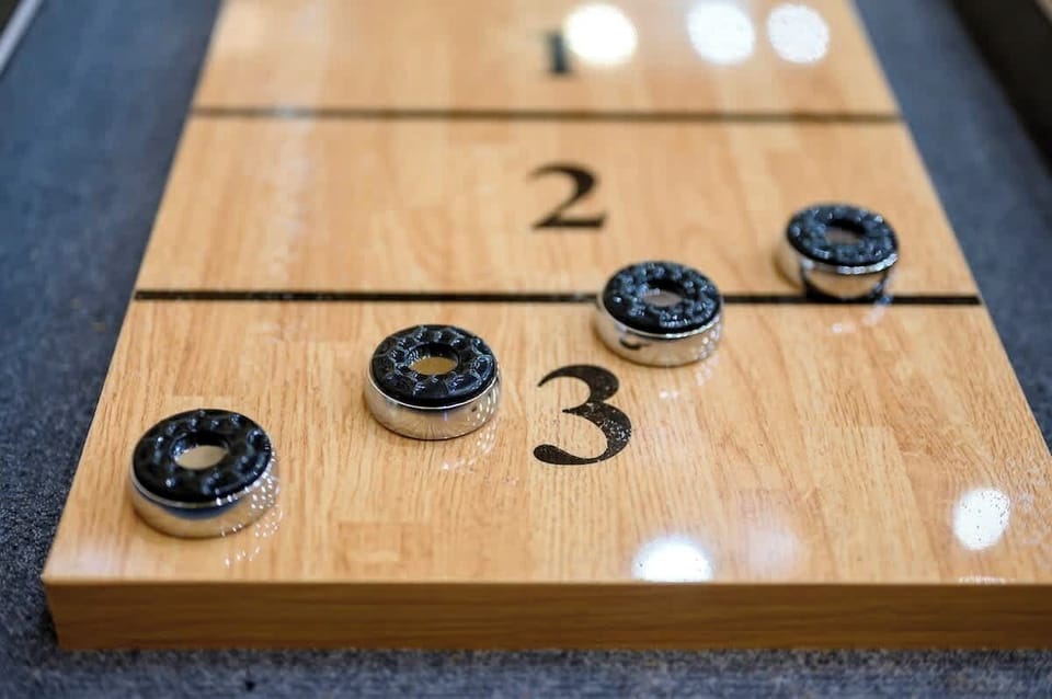 The home also features a full size shuffleboard table so that you can enhance your family game night!
| The Lodge by Boutiq Luxury Vacation Rentals | Broken Bow, Oklahoma