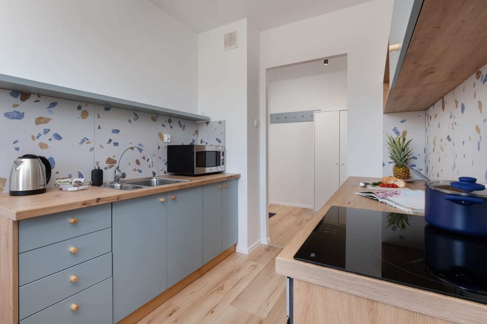 The fully equipped kitchenette includes everything you need for a home-cooked meal.