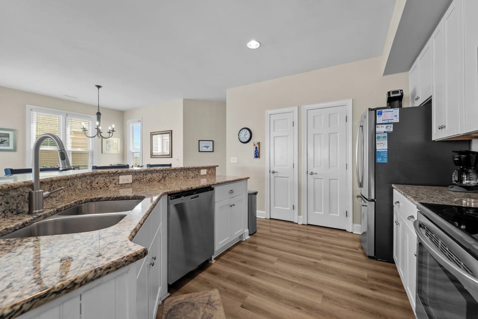 Kitchen with Bar Seating on Third Level