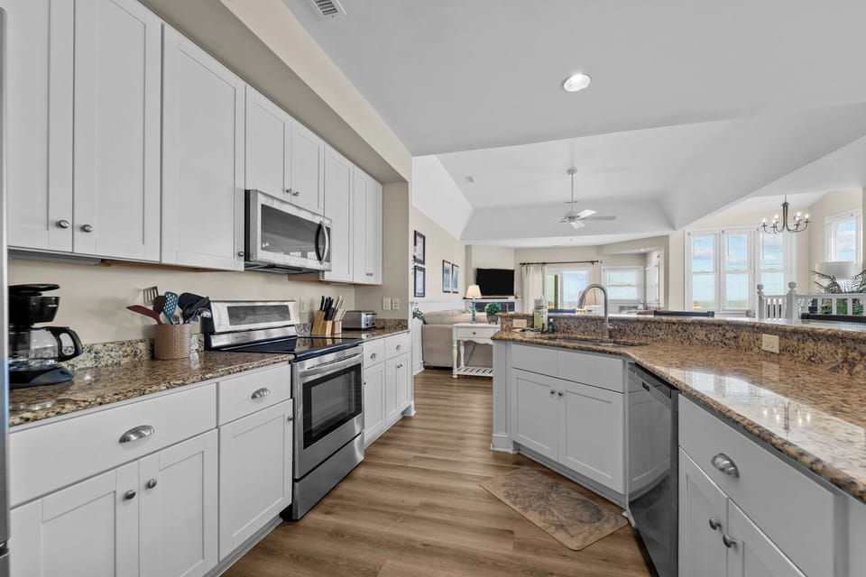 Kitchen with Bar Seating on Third Level