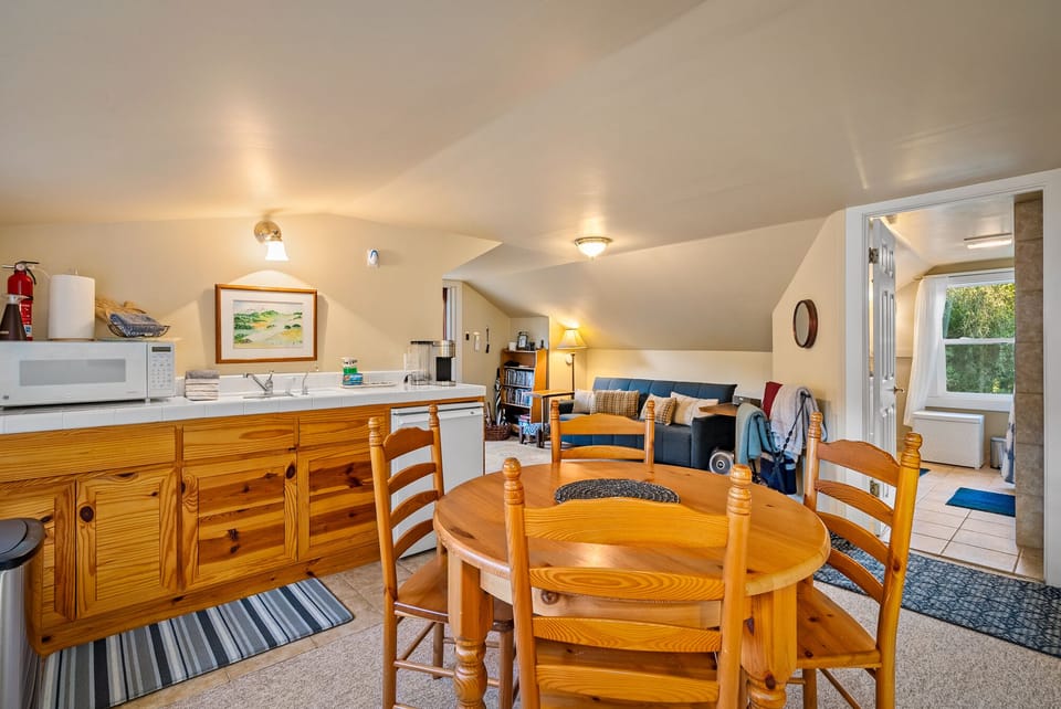 Open living and dining space with a compact kitchen nearby