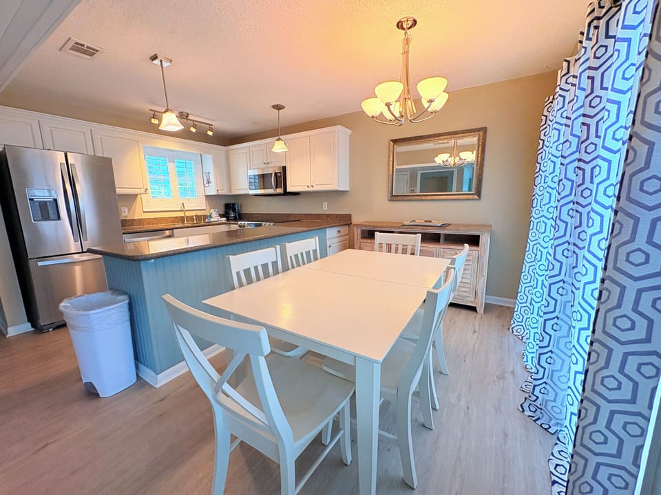 Your spacious kitchen and dining area features modern appliances, granite countertops, and a welcoming table where you'll enjoy memorable meals together.