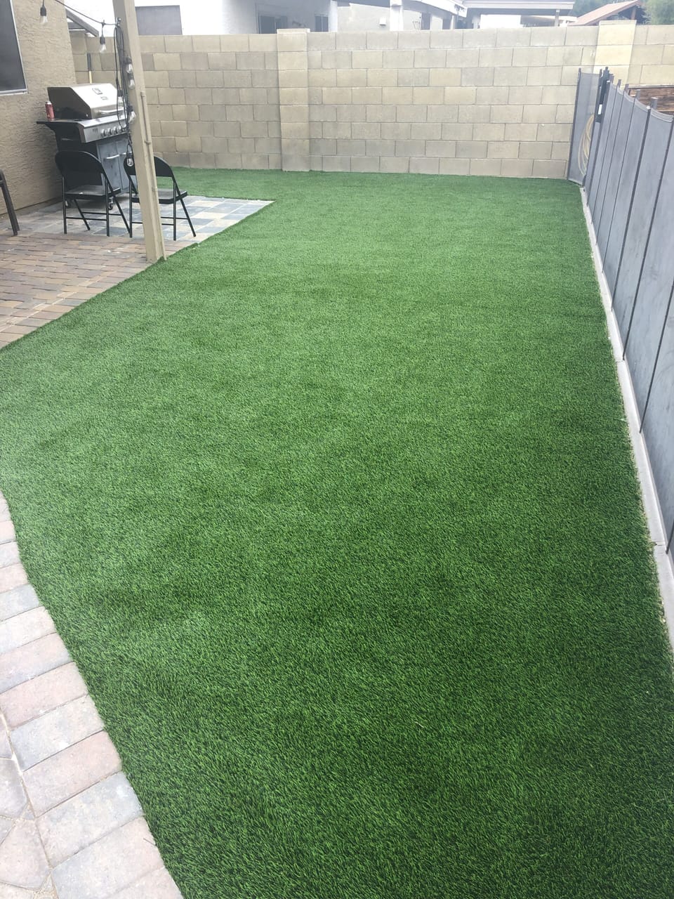 Patio area with grill and picnic bench