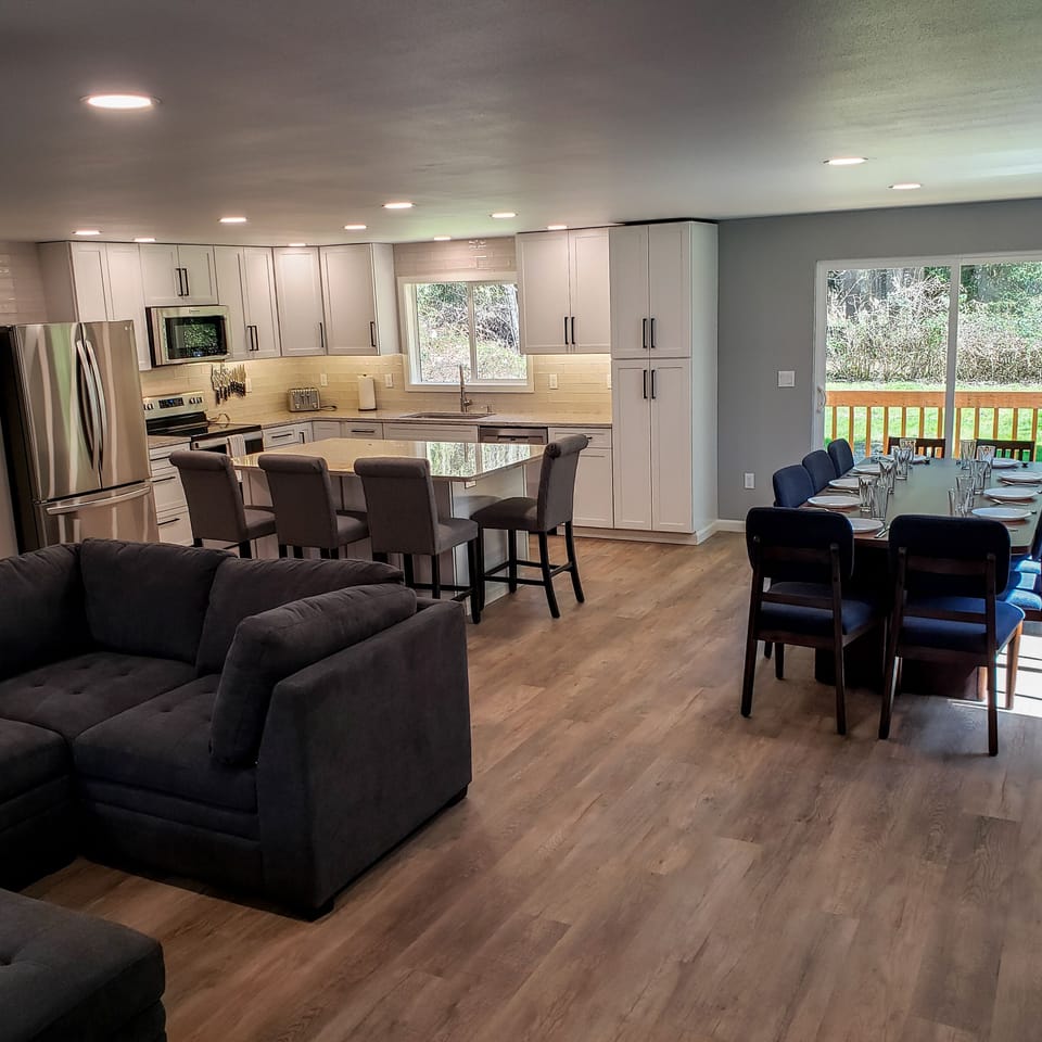 Living room, dining room and kitchen feature an open concept perfect to gather.