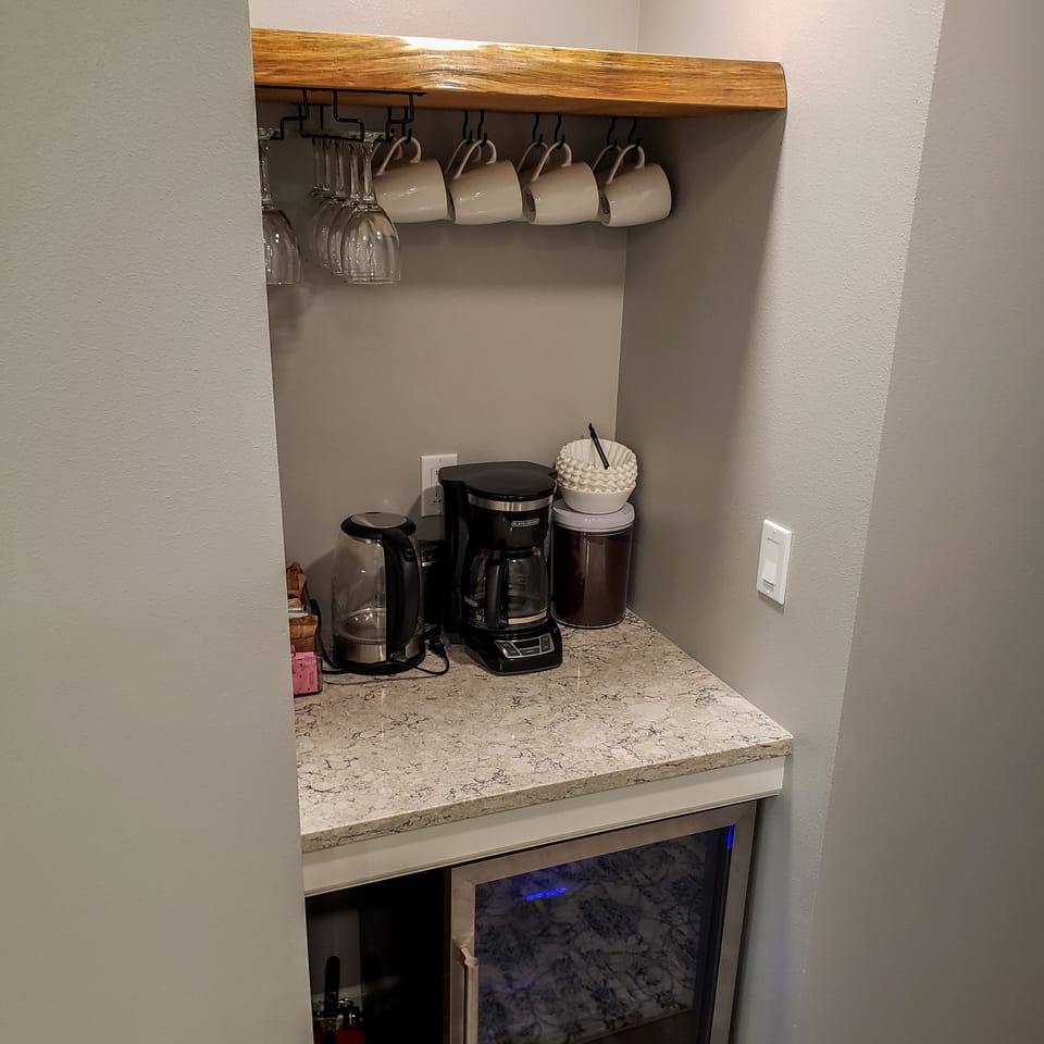 12-cup drip coffee maker, coffee grinder, electric kettle, & beverage fridge. 