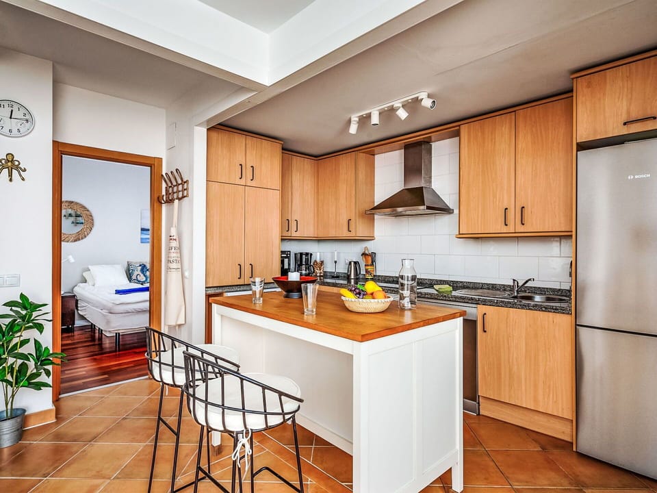 Furniture, Kitchen, Kitchen Appliance, Countertop, Major Appliance, Flooring, Interior Design, Cabinetry, Wood, Floor