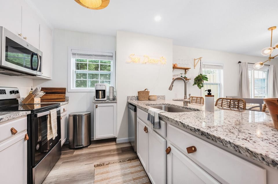 This sleek kitchen contains all the tools you need along with a dishwasher with dishwashing pods for quick and easy clean up.