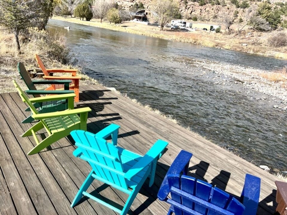 River Deck with six adirondack chairs. 